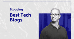 A man in glasses blogging about the best tech blogs.