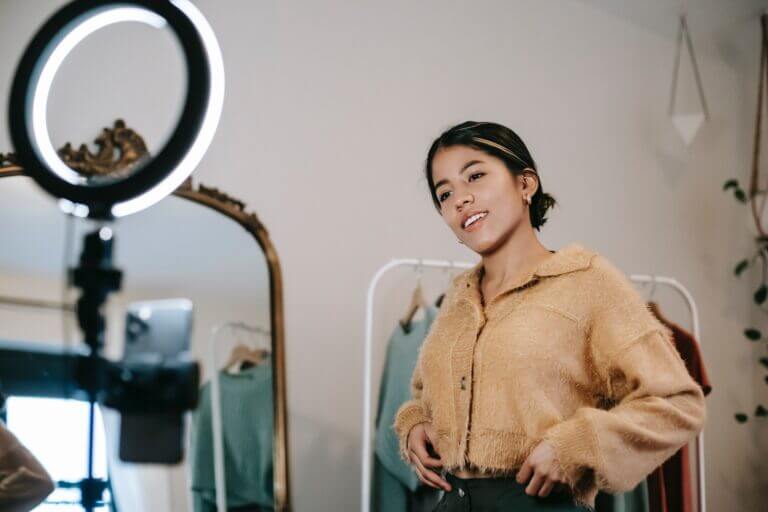 A Woman Posing With A Ring Light For Expert Roundup.